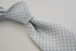 white tie with light blue pin spots